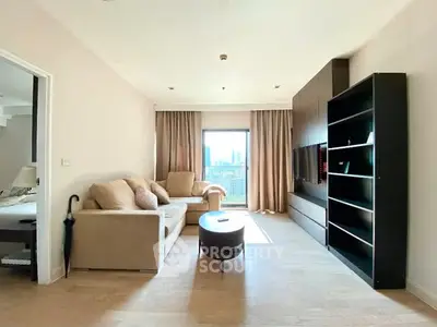Spacious living room with modern furniture and city view, perfect for urban living.