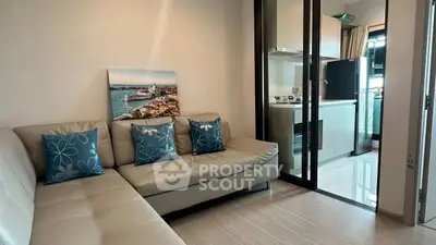 Modern living room with sleek kitchen in open layout apartment