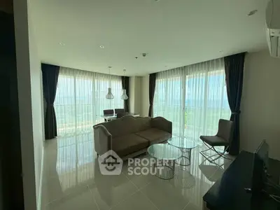 Spacious living room with panoramic windows and modern furniture