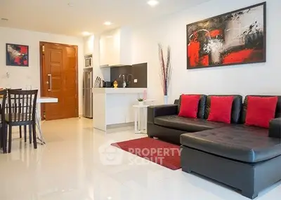 Modern living room with sleek furniture and vibrant decor in a stylish apartment.