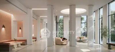 Luxurious modern lobby with elegant seating and large windows offering natural light and garden views.