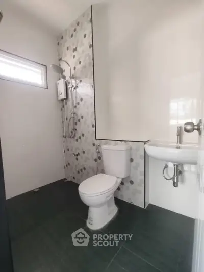 Modern bathroom with sleek fixtures and stylish tile design