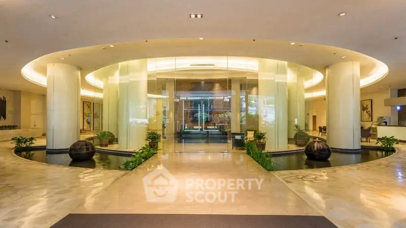 Luxurious building entrance with modern glass doors and elegant lighting
