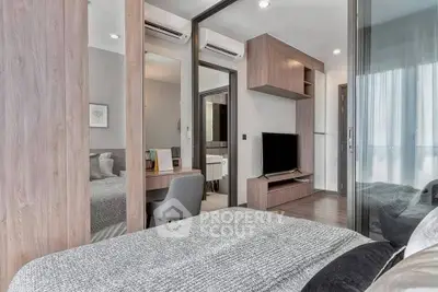 Modern bedroom with stylish decor and built-in storage solutions.