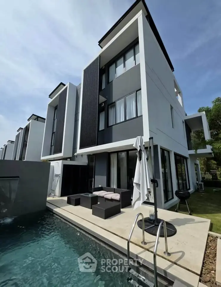 Modern luxury villa with private pool and stylish outdoor seating area