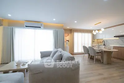 Spacious modern living room with open kitchen and elegant decor