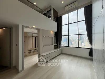 Spacious modern loft with large windows and city view