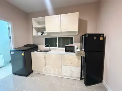 Modern kitchen with sleek appliances and ample storage space