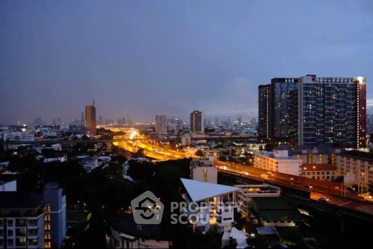 Stunning cityscape view with illuminated skyline and modern high-rise buildings at dusk.