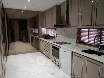 Luxurious modern kitchen with sleek cabinetry and marble countertops