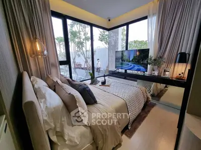 Luxurious bedroom with floor-to-ceiling windows and modern decor