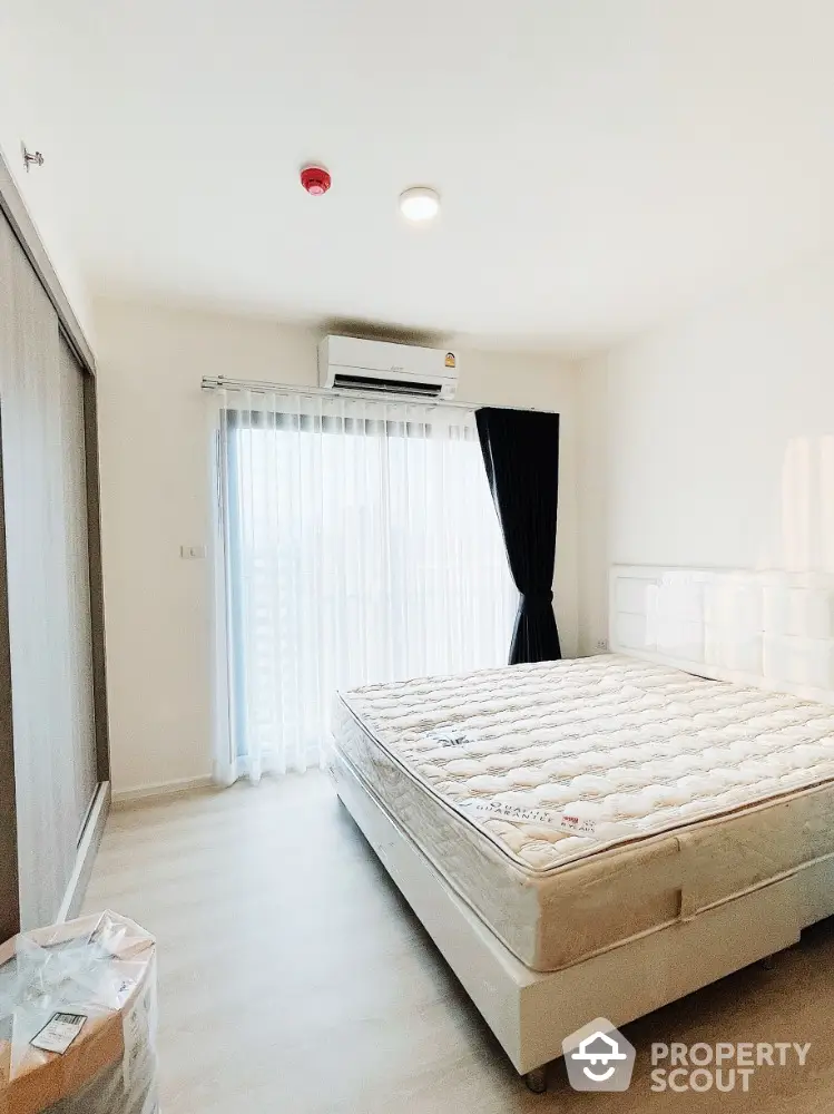 Modern bedroom with natural light and minimalist design