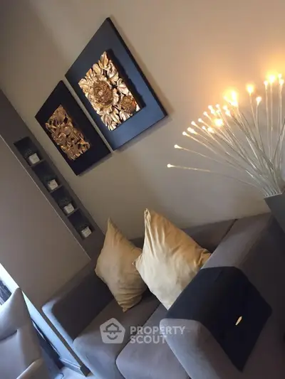 Stylish living room with modern decor and cozy seating area, perfect for relaxation.