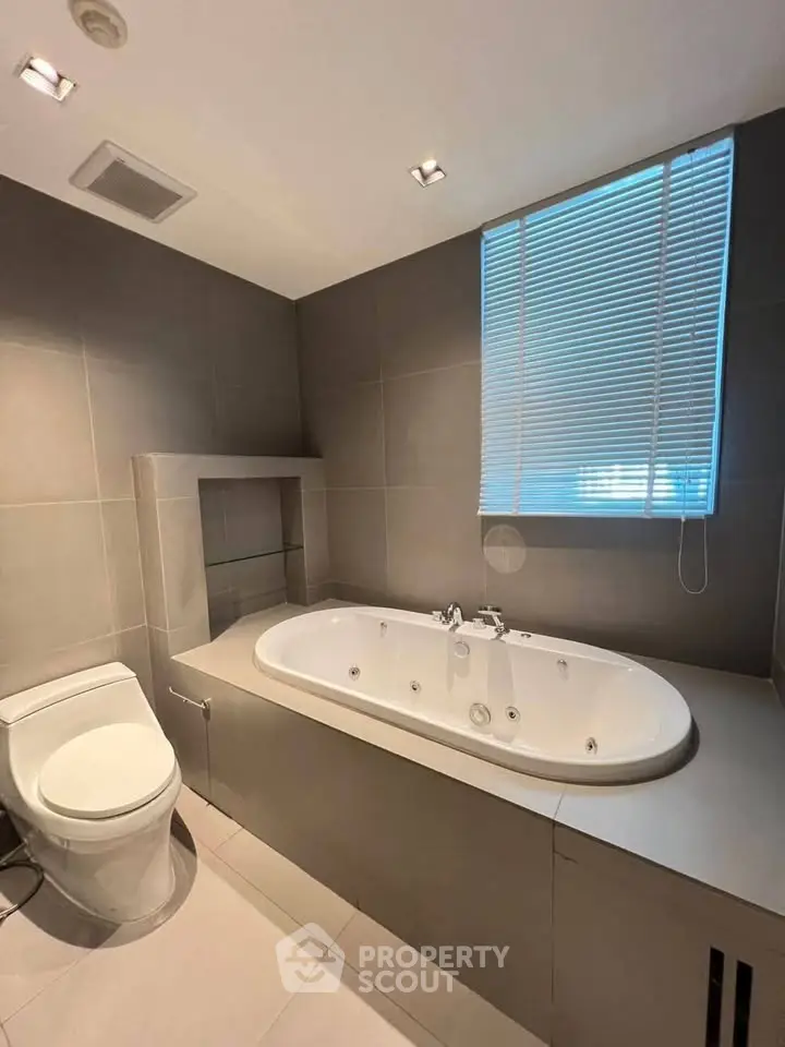 Luxurious bathroom with modern bathtub and sleek tile design