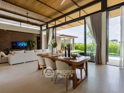 Luxurious open-plan living room with dining area and stunning garden view