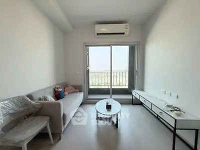 Modern living room with balcony view and minimalist furniture