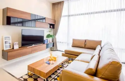 Modern living room with sleek furniture and large windows for natural light.