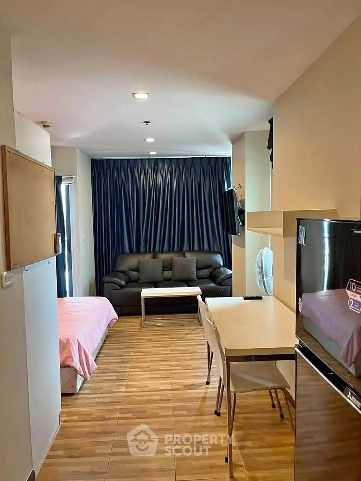 Modern studio apartment with cozy living area and stylish decor