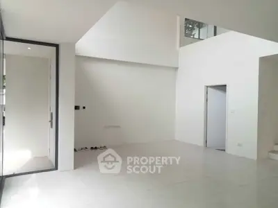 Spacious modern interior with high ceilings and minimalist design