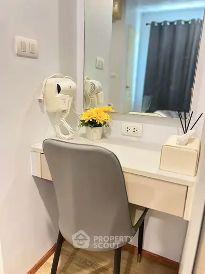 Cozy bedroom corner with vanity desk and mirror, perfect for morning routines.