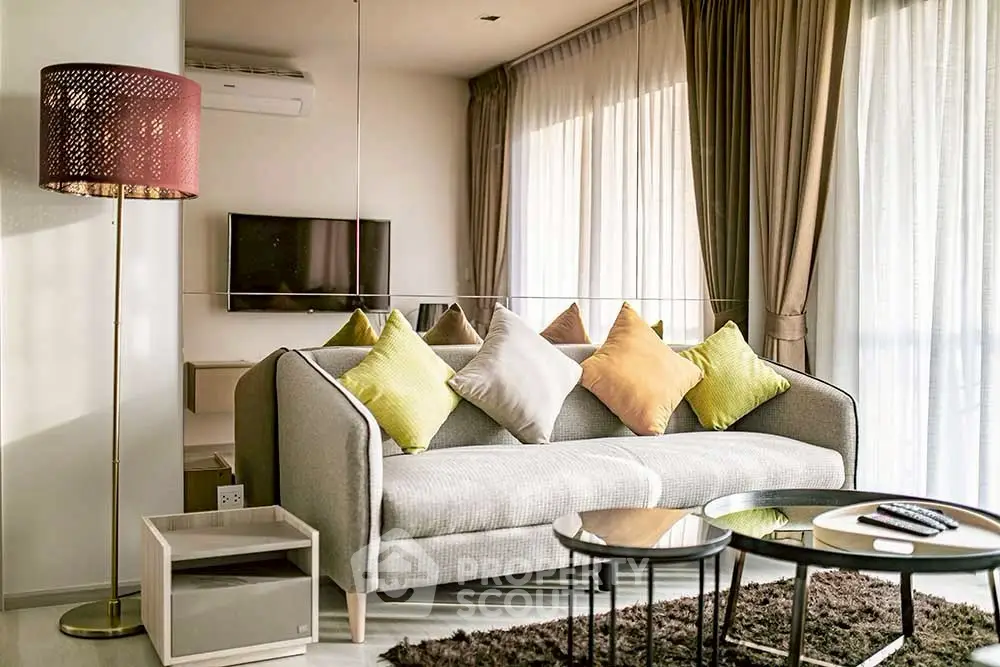 Stylish living room with modern decor and cozy ambiance, featuring a plush sofa and elegant lighting.