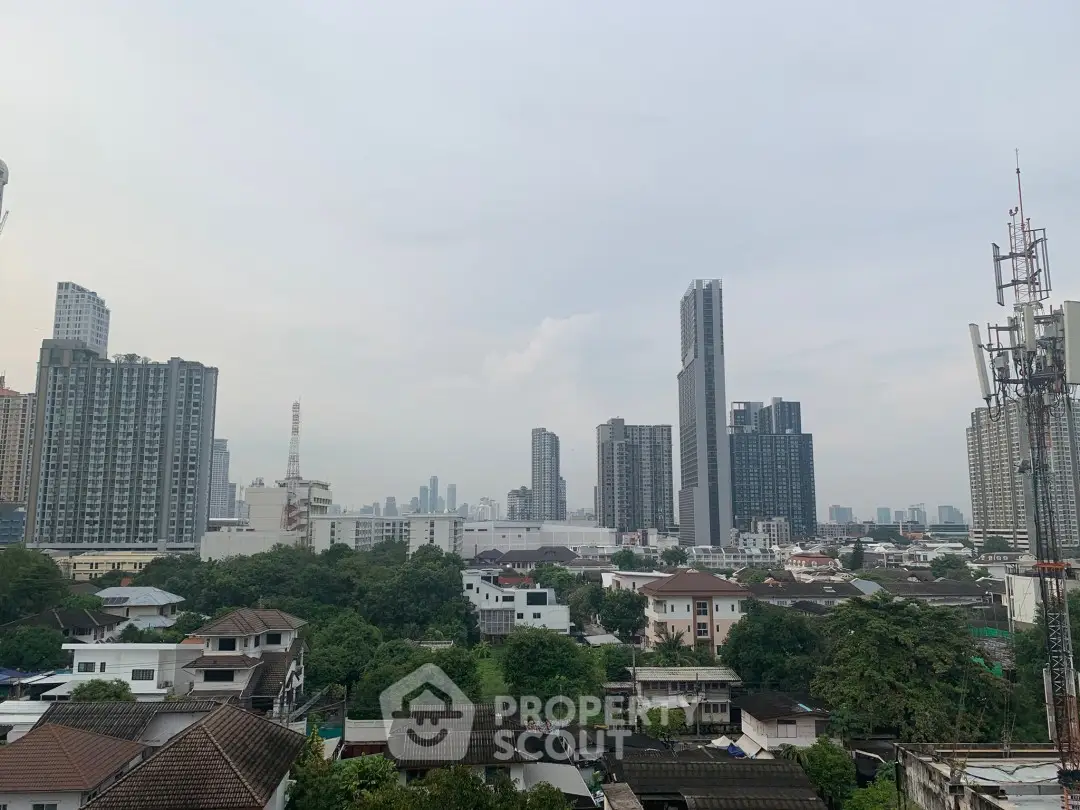 Stunning cityscape view showcasing modern skyscrapers and lush greenery, perfect for urban living enthusiasts.