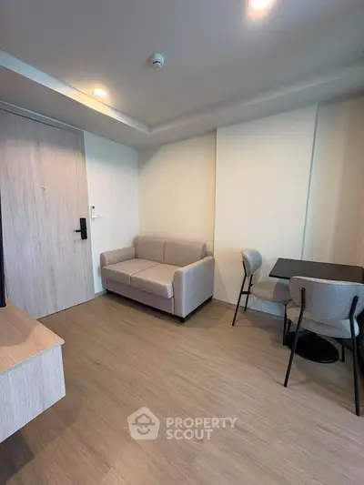 Modern living room with cozy sofa and dining area in stylish apartment