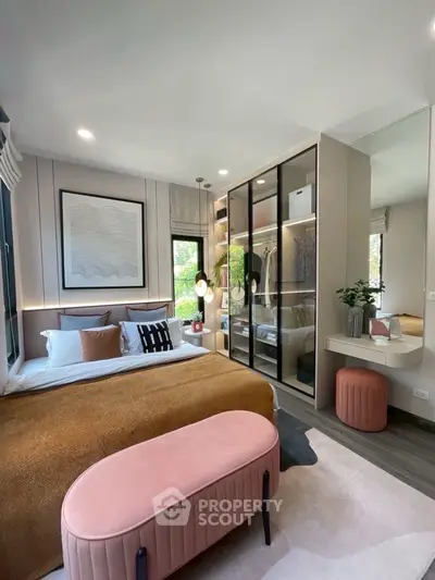Stylish bedroom with modern decor and large mirrored wardrobe