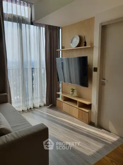 Modern living room with large window and stylish TV setup