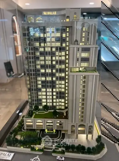 Stunning architectural model of a modern high-rise building with lush landscaping and elegant design.