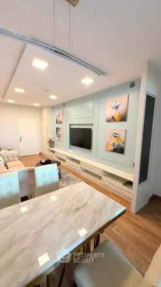 Modern living room with stylish decor and built-in TV unit