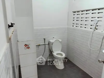 Modern bathroom with white subway tiles and sleek fixtures