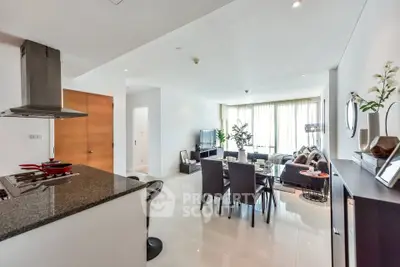 Spacious modern living room with open kitchen and elegant dining area