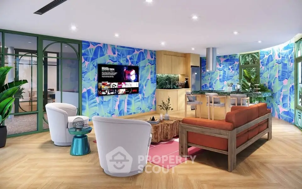 Vibrant living room with tropical wallpaper, modern furniture, and open kitchen layout.