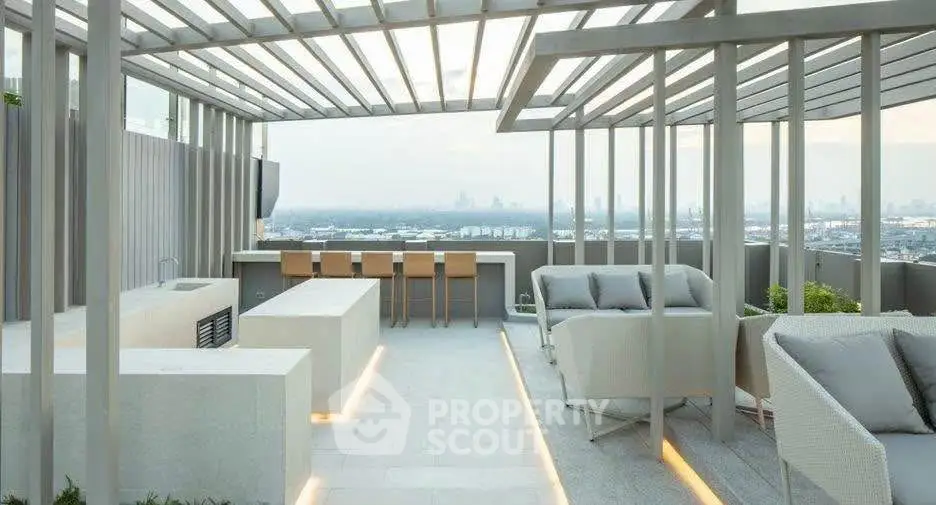 Luxurious rooftop terrace with modern seating and stunning city views, perfect for entertaining.