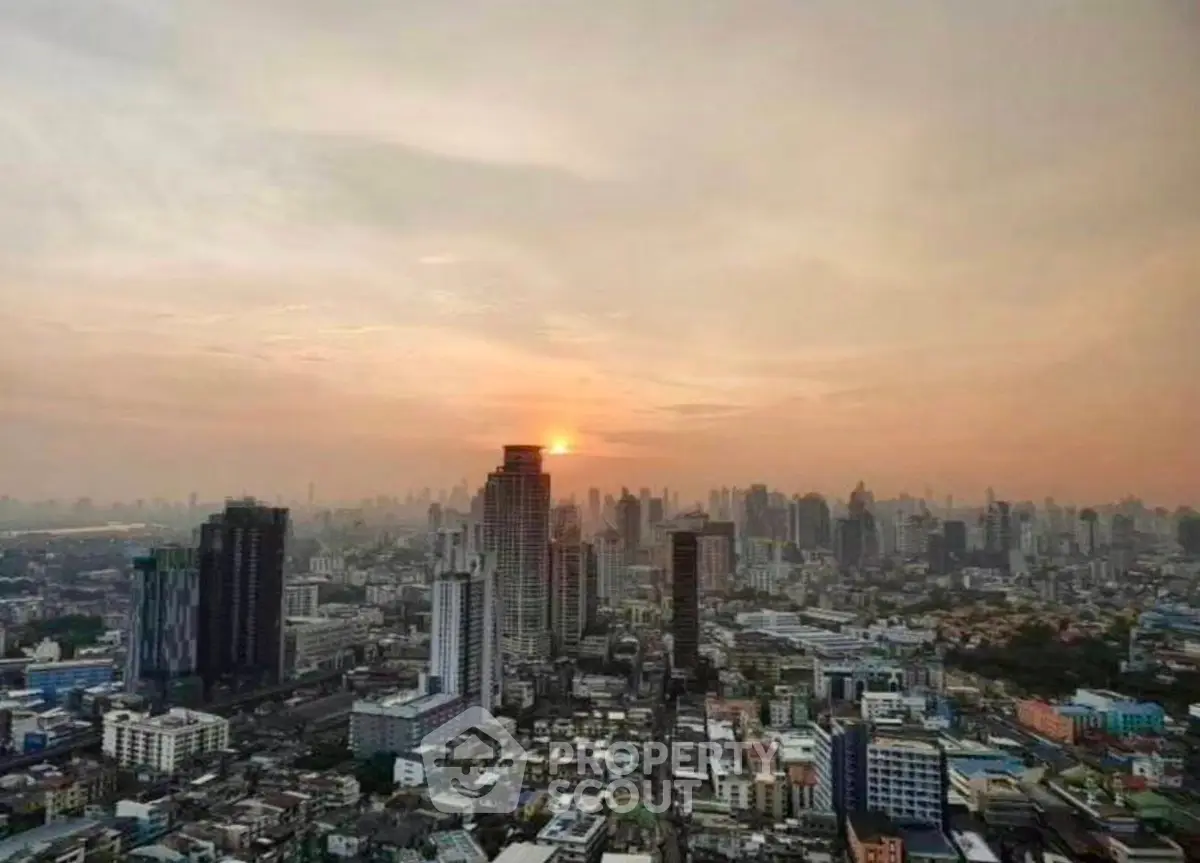 Stunning cityscape view at sunset showcasing a vibrant urban skyline with high-rise buildings.