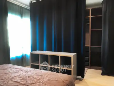 Spacious bedroom with modern closet and elegant curtains
