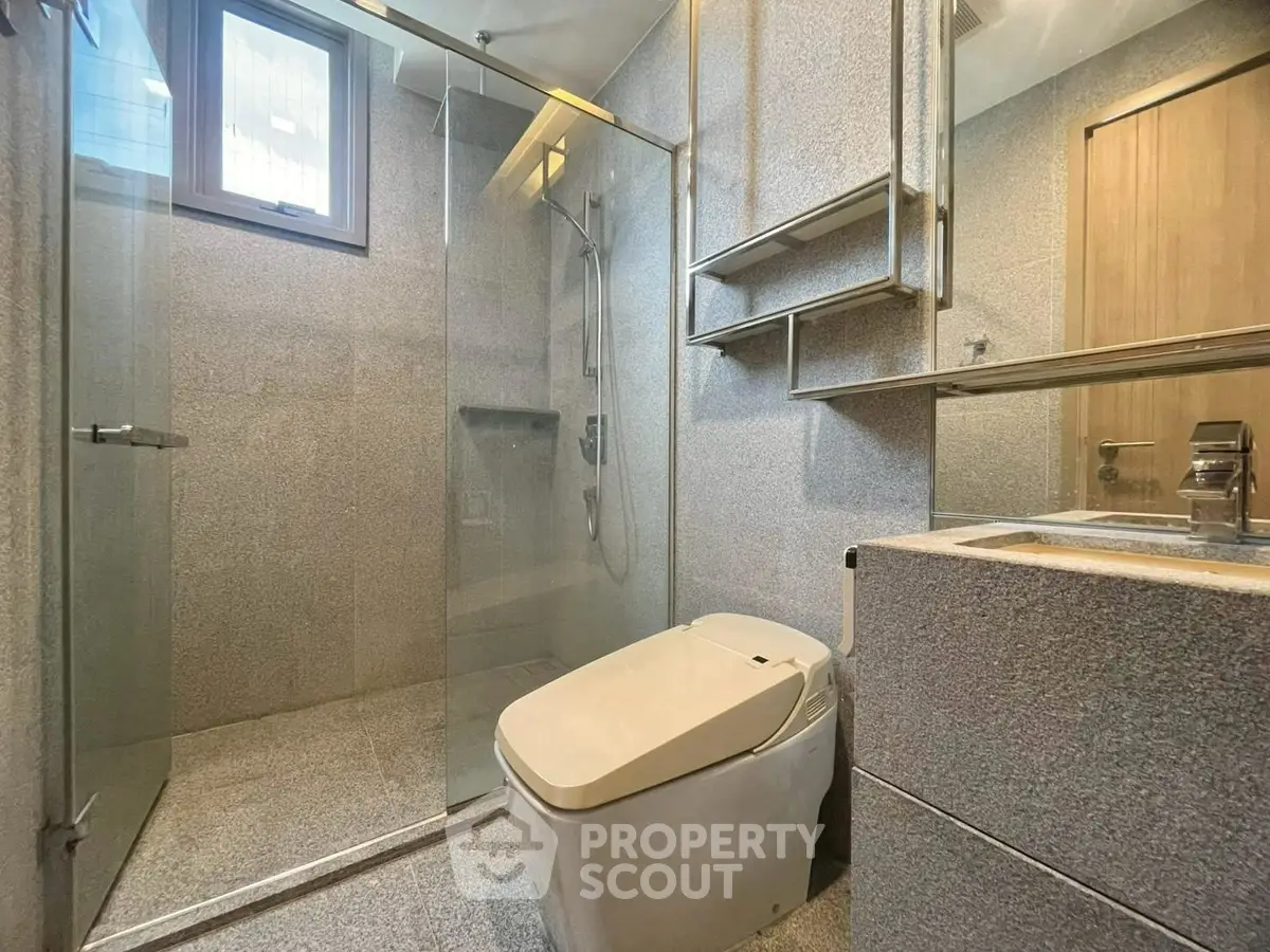 Modern bathroom with sleek design and glass shower enclosure