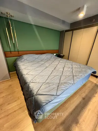 Spacious bedroom with modern decor and cozy bedding