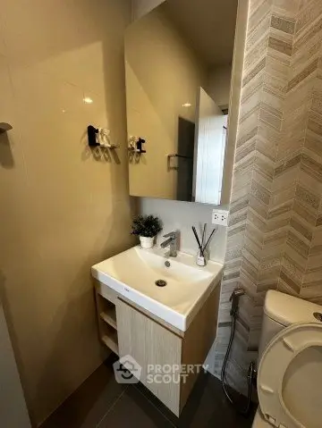Modern bathroom with sleek sink and stylish tile design
