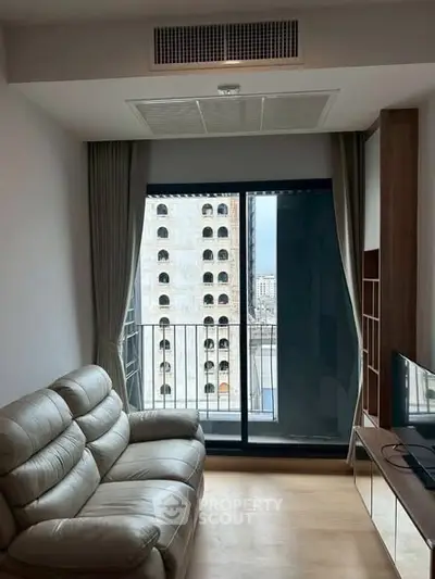 Modern living room with balcony view in urban apartment