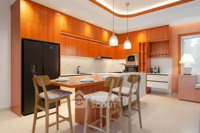 Modern kitchen with sleek wooden cabinetry and island seating