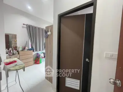 Cozy interior view featuring a bedroom with modern decor and ample natural light.
