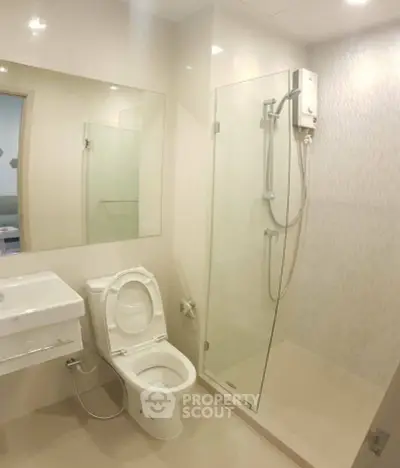 Modern bathroom with glass shower and sleek fixtures