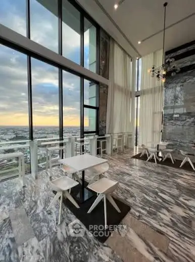Luxurious high-rise building with stunning panoramic views and elegant marble interiors.