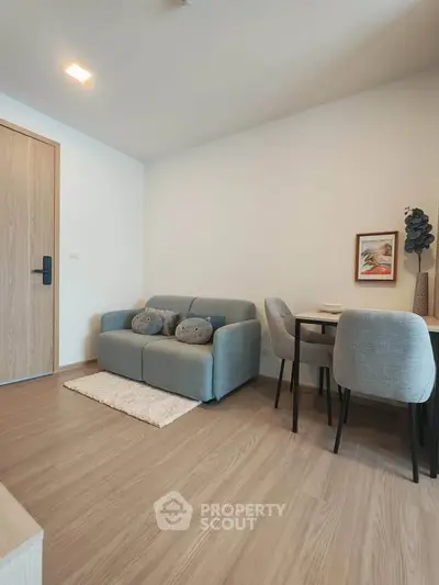 Modern living room with cozy sofa and dining area in stylish apartment