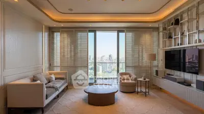 Luxurious living room with stunning city view, elegant furniture, and modern design.