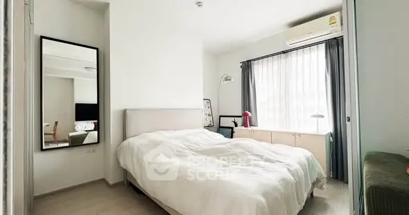 Bright and cozy bedroom with modern furnishings and natural light.