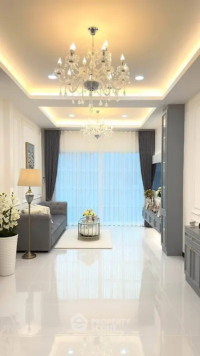 Luxurious living room with elegant chandeliers and modern decor