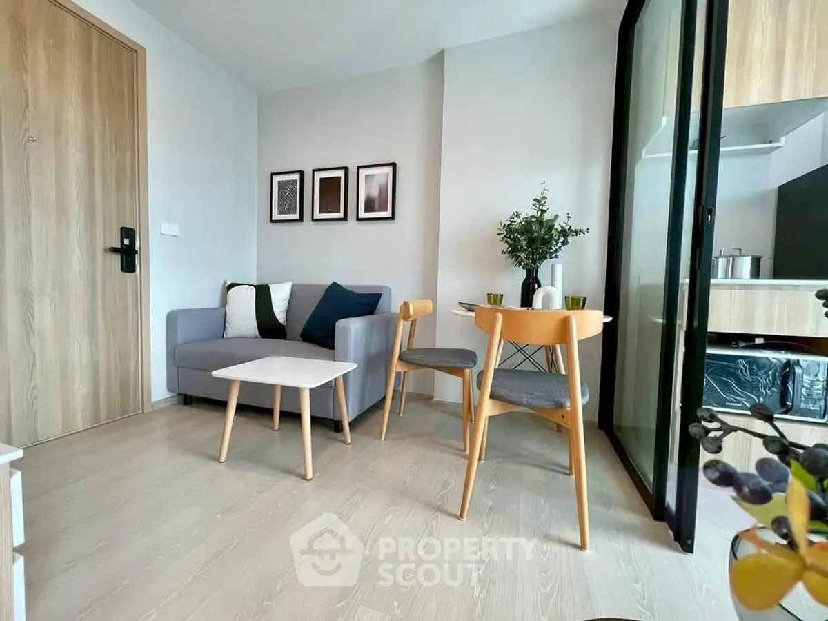 Modern living room with cozy seating and stylish decor in a contemporary apartment.